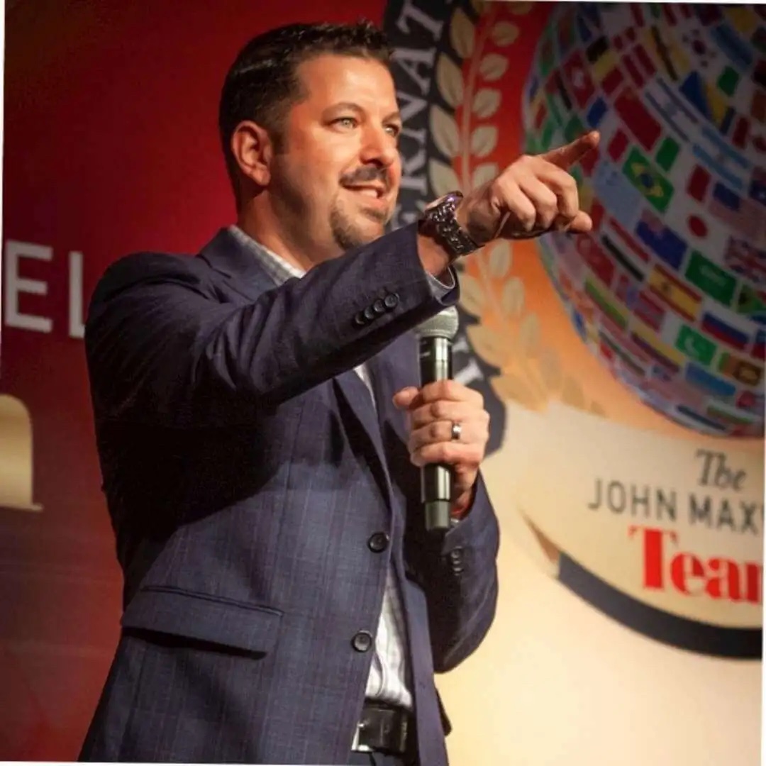 Jarrod Saltzman coaching on stage — DISC leadership coach for leaders and teams